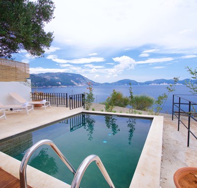 Pool, sun loungers and views outside Villa Vivere, Assos, Kefalonia