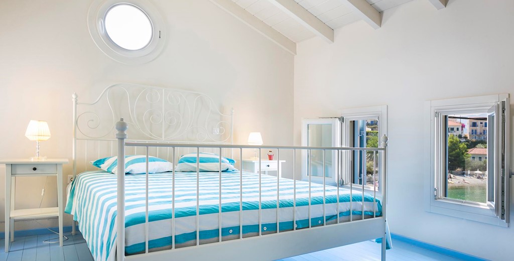 Clean bright open relaxed bedroom with double bed inside Thalassa House, Assos, Kefalonia, Greek Islands