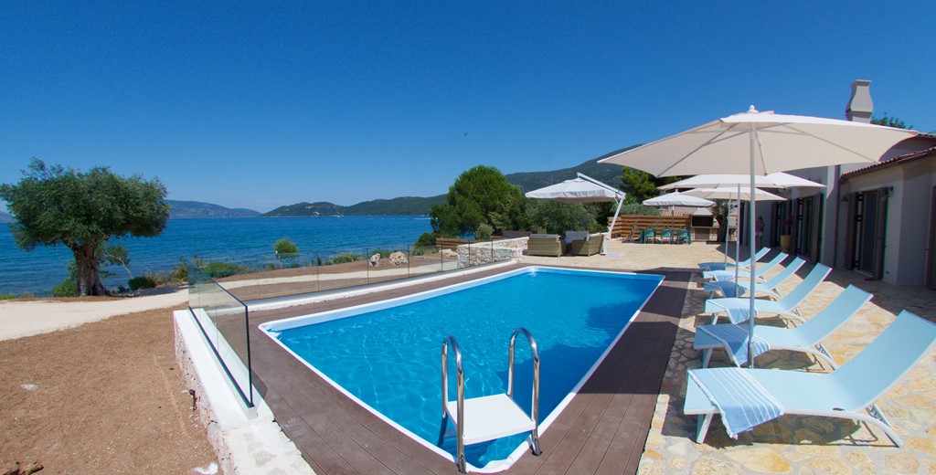Pool sun beds and sea view outside Villa Frydi, Karavomilos, Kefalonia, Greek Islands