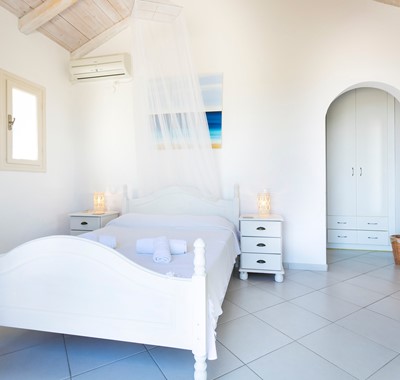 Bright stonewashed double bedroom at Villa Lithia, Fiscardo, Kefalonia, Greek Islands