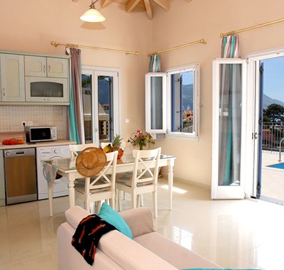 Dining and kitchen with French doors and view out into the bay, Villa Panorama, Assos, Kefalonia