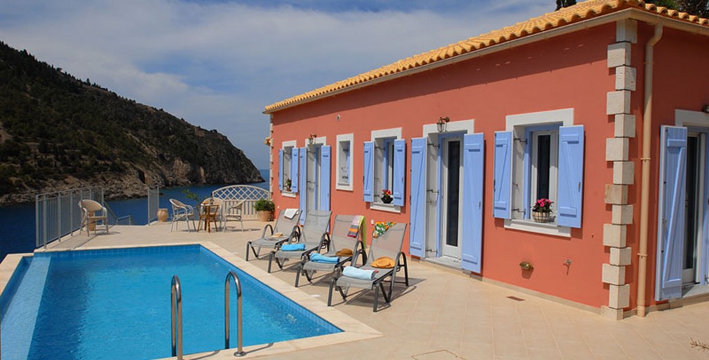 Colourful Villa Panorama, its pool and sun loungers, Assos, Kefalonia