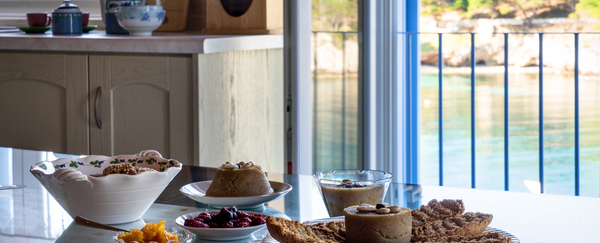 Breakfast indoors with waterfront view at Villa Petrino, Assos, Kefalonia, Greek Islands