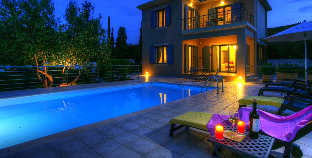 Relax poolside soaking up the calm atmosphere with an evening drink at Villa Roberto, Fiscardo, Kefalonia, Greek Islands