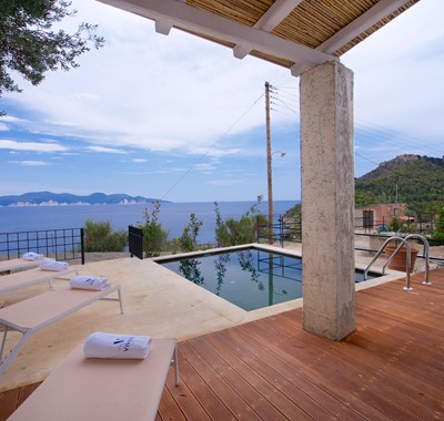 Decked veranda with pool and views out to the Mediteranean at Villa Vivere, Assos, Kefalonia